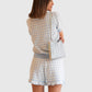 Allude Shorts Blue White Check von hinten getragen mit passendem Poloshirt