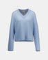 Light blue cashmere sweater, front view with a V-neck and long sleeves.