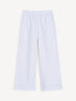 White wide-leg pants with fine black stripes and striped hems, front view.