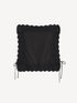 Black cotton top, front view with broderie anglaise edging and side ties at the waist.
