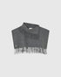 Grey Turtla wool neck warmer, front view with a high folded collar, fringed edges and a small monogram.