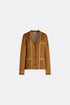 Amber-gold cardigan with a notched collar and cream piping, front view.