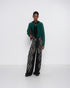 Green, black and gold lamé wide-leg pants with a diamond pattern, front view on model.