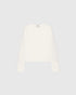 White collarless blazer with a round neckline, chest patch pocket and satin cuff details, front view.
