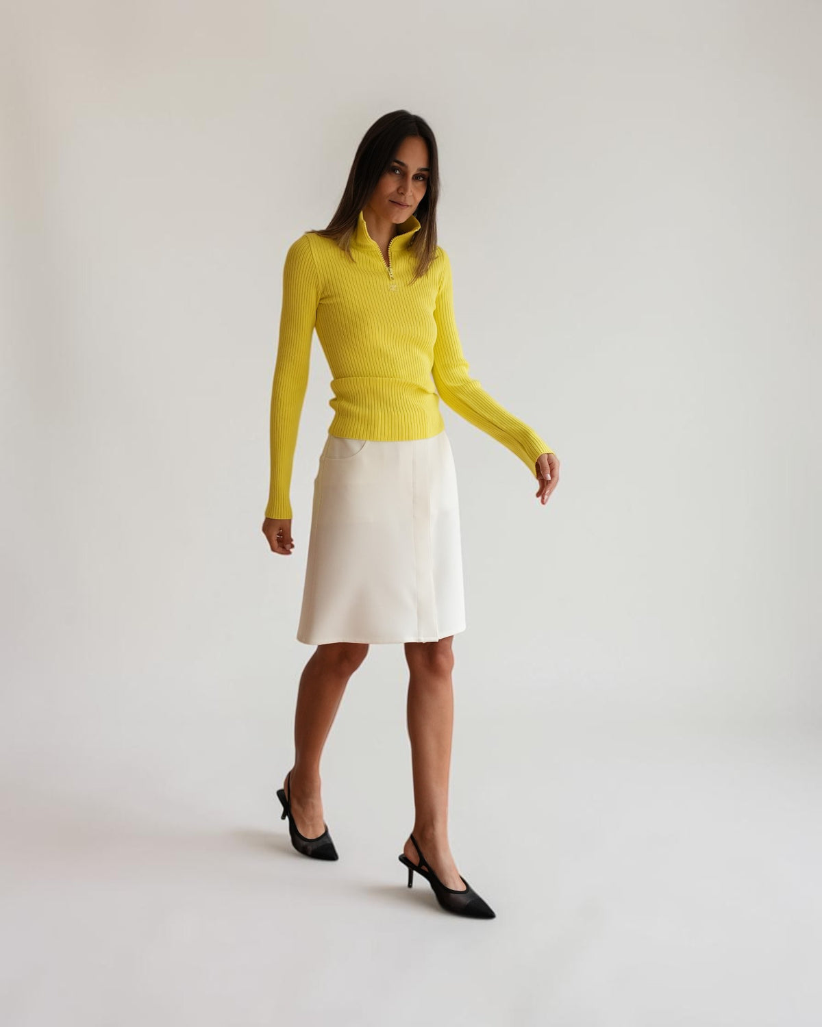 White Courrèges pencil skirt shown on a model from the front