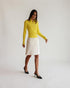 White Courrèges pencil skirt shown on a model from the front