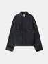 Dark blue denim jacket with a stand collar, chest flap pockets and contrast stitching, front view.