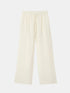 Cream wide-leg pants with an elasticated drawstring waist, front view.