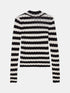 Black and cream striped openwork knit top with long sleeves and a round neck, front view.