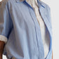 Detail der Dorothee Schumacher Powerful Ease Bluse Hellblau Weiss als Stoff- und Farbansicht