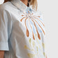Detail der Dorothee Schumacher Floral Power Bluse Signature Print von vorne getragen