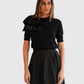Detail des Dorothee Schumacher Pullovers mit abnehmbarer Schleife Schwarz von vorne getragen