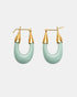 Mint acetate U-shaped earrings with pointed gold-tone end caps, shown as a pair.