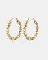Oval gold-tone hoop earrings with pearly white beads and winding metal details, shown as a pair.