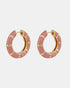 Small pink enamel hoop earrings with gold-tone bamboo-style segments, shown as a pair.