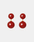 Pair of red carnelian drop earrings with two round stones and gold-tone links.