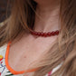 Lié Studio Mary Kette Red im getragenen Styling als Detail