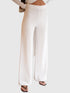 White rib-knit pants with an elasticated waist and wide legs, cropped front view on a model.
