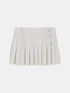 Beige-grey pleated mini skirt with a wide waistband and side buttons, front view.