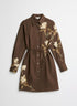 Brown shirt dress with cream iris flowers, long sleeves and a thin tie belt, front view.
